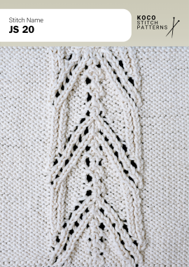 A slender central leaf cable brings graceful structure and subtle openwork to handknit fabric Close-up of the JS 20 handknit stitch pattern in white yarn, featuring a central leaf-shaped cable motif with eyelet lace and textured vertical columns