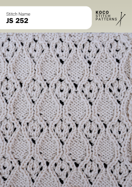 Repeating cable panels and openwork details create a balanced, richly textured handknit design Close-up of the JS 252 handknit stitch pattern in white yarn, featuring repeating textured cable panels and subtle eyelet lace openings