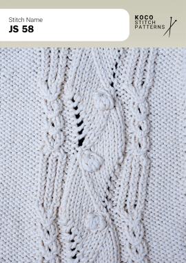 Central bobble accents and softly shaped cable leaves create a refined handknit focal point Close-up of the JS 58 handknit stitch pattern in white yarn, showing a leaf-shaped cable panel with central bobble accents and eyelet lace details