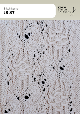 Alternating raised cable sections create a bold, architectural texture with handknit character Close-up of the JS 87 handknit stitch pattern in white yarn, showing raised cable blocks, textured stitch columns, and small openwork lace detail