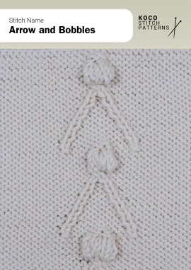 The Arrow and Bobbles pattern features bold arrows accented with raised bobbles Close-up of the Arrow and Bobbles stitch in cream yarn, showing vertical arrows with raised bobble details